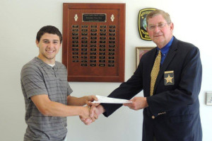 Smyth County Sheriff David Bradley (r) presents Dustin Wilson with his VSI scholarship check.